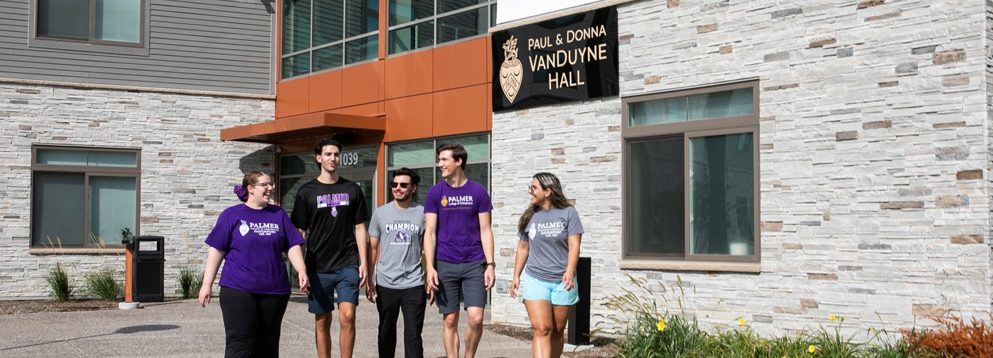 Group of students walking in front of VanDuyne Hall.