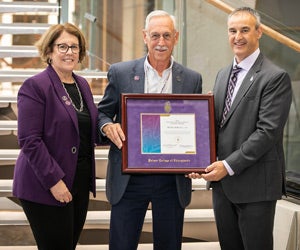 Dr. Mickey Burt receiving award