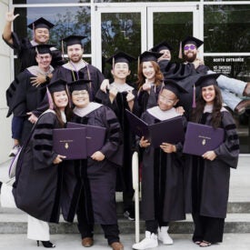 West class 170 in graduation caps and gowns.