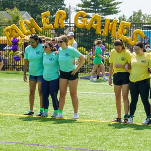 Three-legged race at Palmer Games on the recreation field.