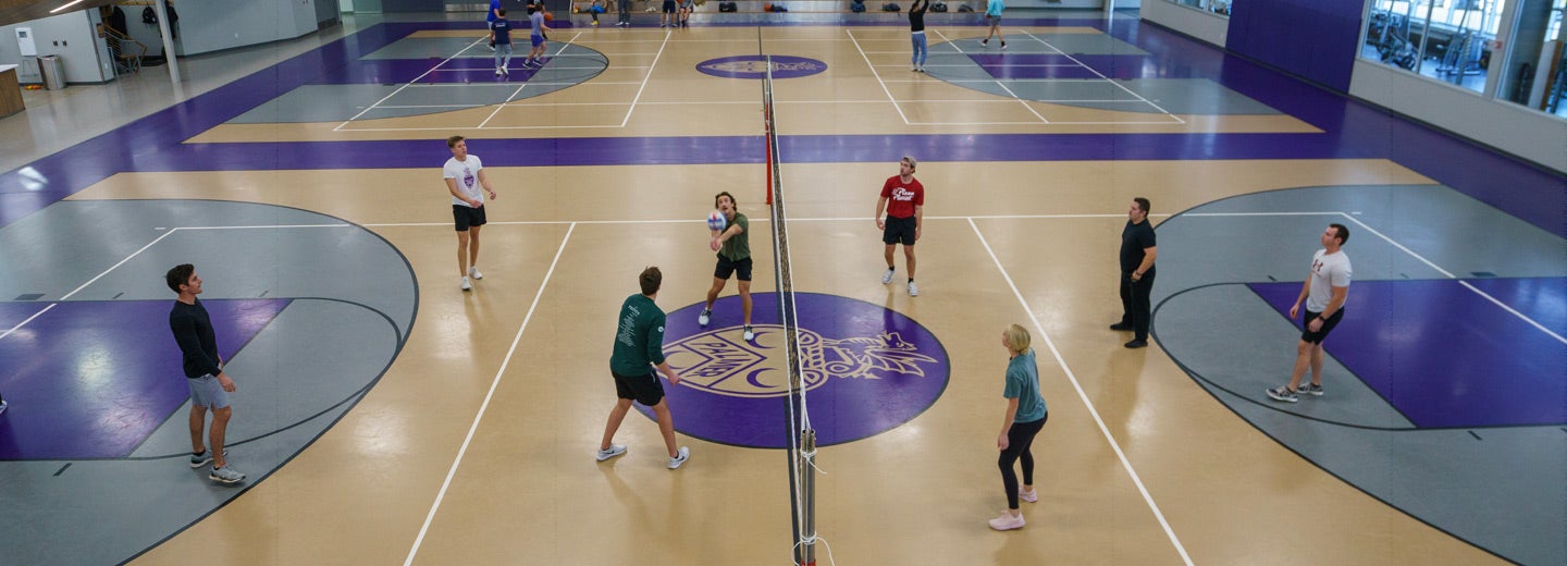 Volleyball players on the Bittner Center court.